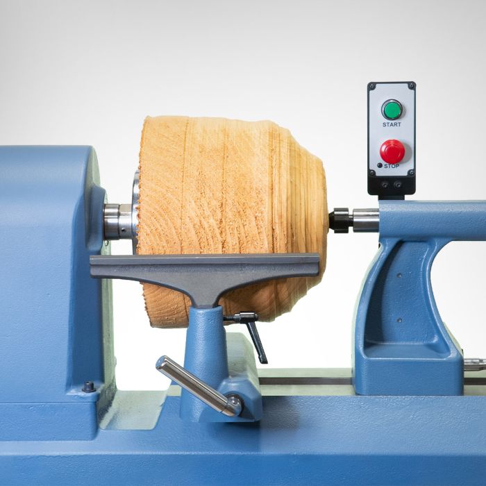 Closeup of the Oliver Machinery 18" professional lathe, with a piece of wood being milled