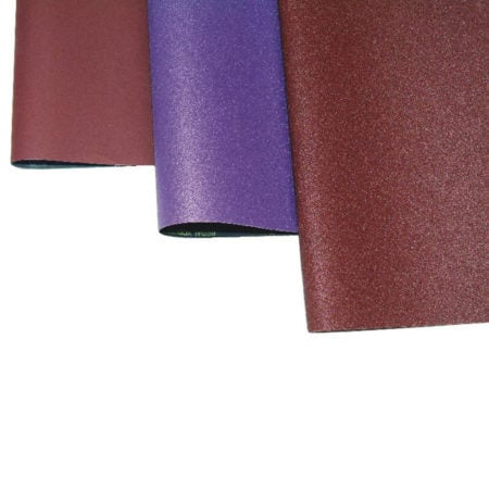 Safety Speed sanding belts, one in purple, one in brown
